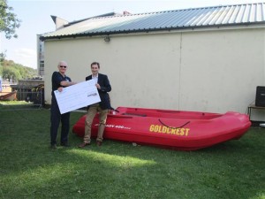 3rd Osterley Sea Scouts Anniversary 27Sep15. Mick Heath, Group Chairman receiving donation from Ben Leek of Goldcrest Land Community Fund, for the new Pioneer Steady 400 safety boat