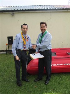 3rd Osterley Sea Scouts Anniversary 27Sep15. Colin Porter, District Commissioner for Thameside Grand Union District, presenting Philip Dear with the Medal Of Merit